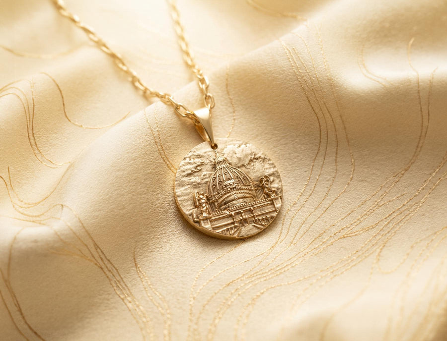 A high-resolution studio photograph of a circular sterling silver pendant suspended from a sturdy chain. The face of the medallion features a highly detailed, three-dimensional bas-relief carving of the Castle of the Holy Angel (Castel Sant'Angelo). The intricate architecture, including the grand dome, colonnades, and angel statues, is polished to a bright shine, while the background sky and recesses are heavily oxidized to a dark matte gray, (etsy image id: 7912107724)