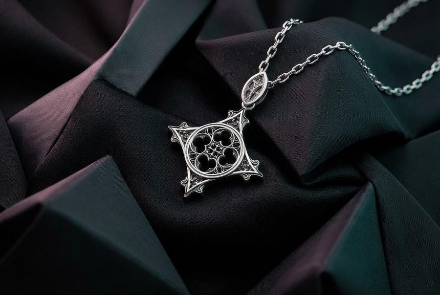 Showcasing exceptional openwork silversmithing, this gothic cross pendant demonstrates precise micro-casting techniques. The slender mullions and tracery lines are perfectly symmetrical and structurally sound, maintaining the airy lightness of a true cathedral window. A sturdy, intricately decorated silver bail is seamlessly integrated into the top point, ensuring the heavy charm hangs perfectly balanced on its chain. (etsy image id: 8027043505)